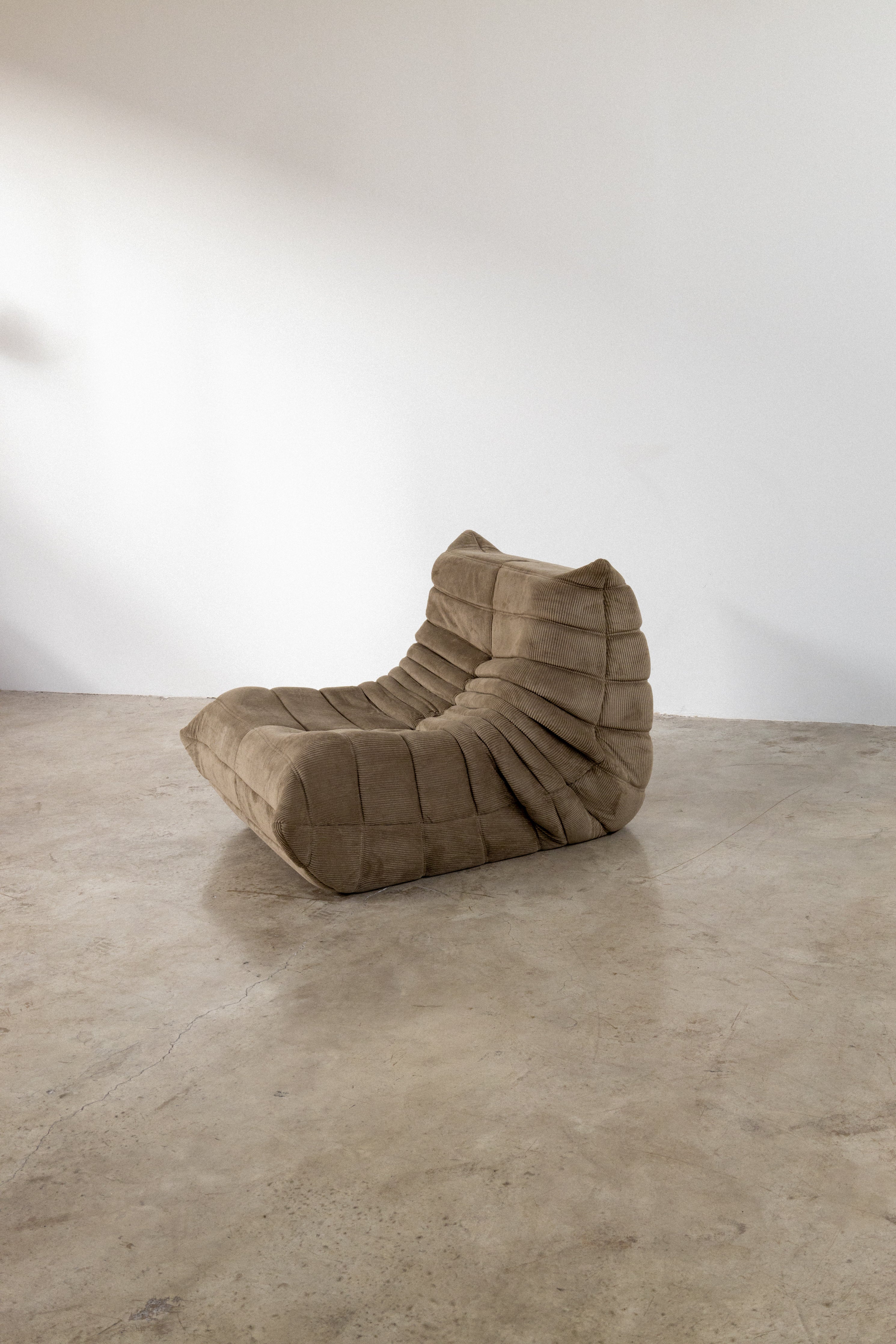 Modular light brown corduroy one-seater sofa with unique textured design, perfect for modern living spaces.