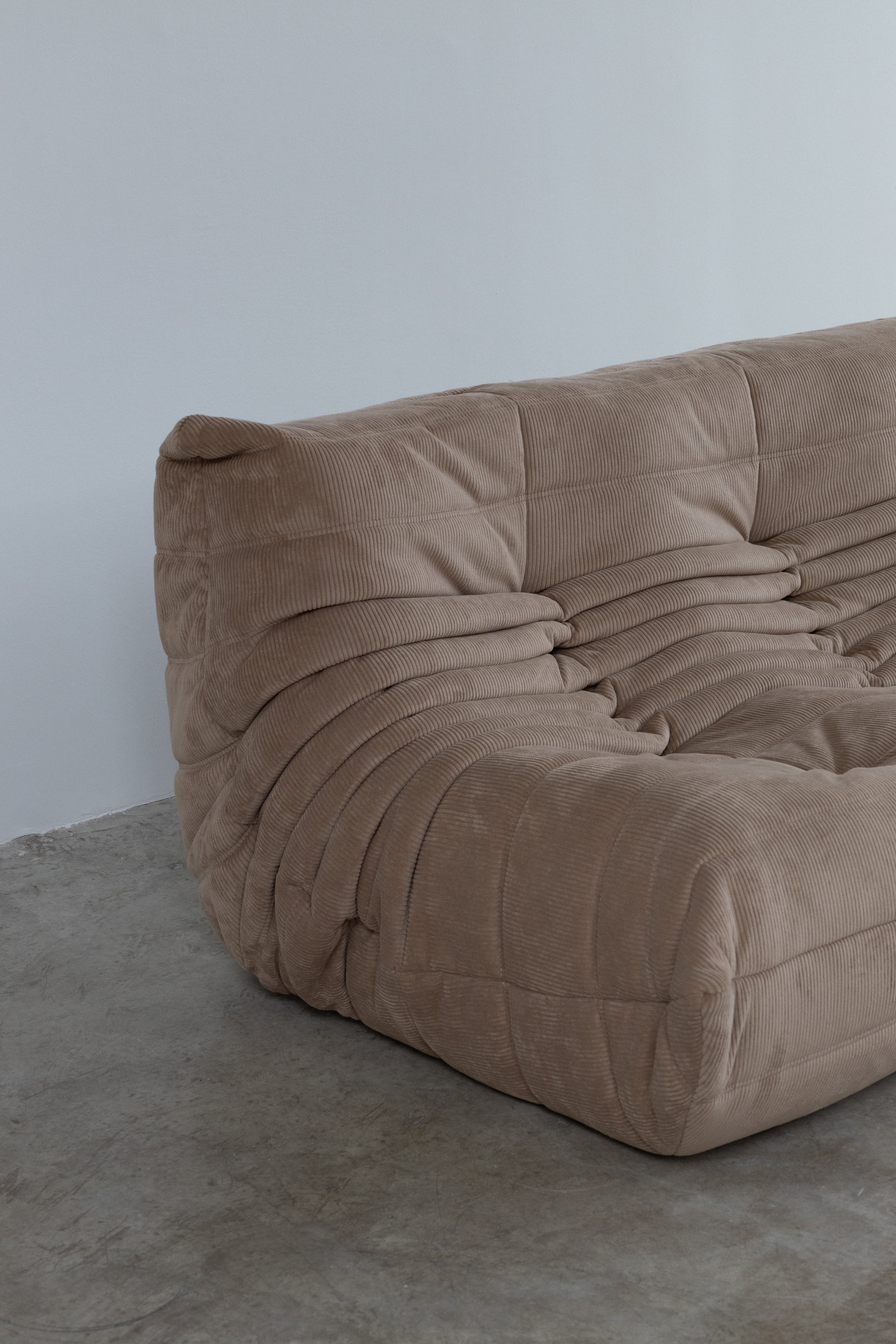 Modular taupe corduroy 3-seater sofa showcasing plush texture and modern design, ready for delivery.
