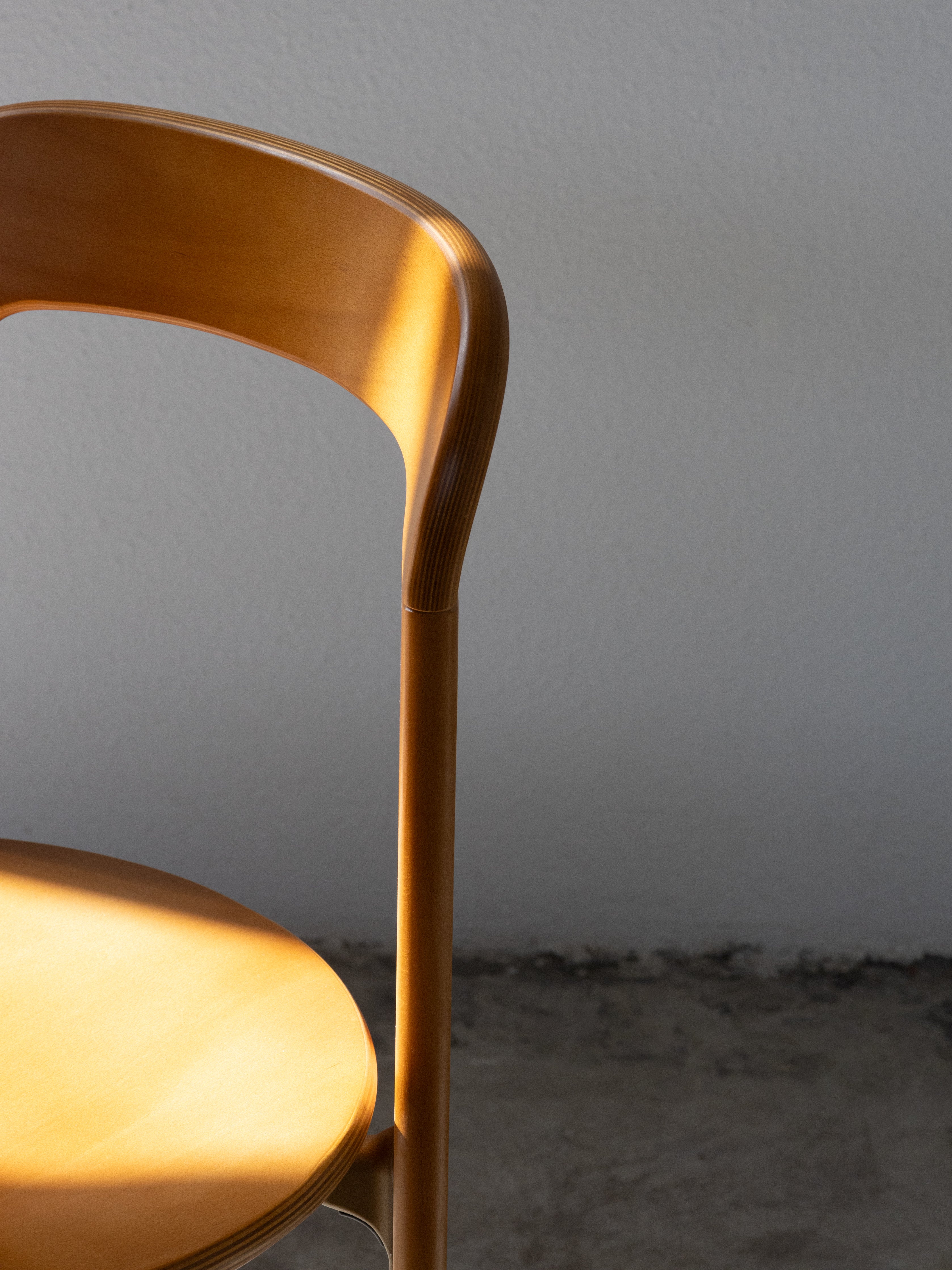 Wooden chair against a plain wall, Rey Chair